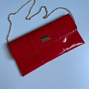 Red Clutch Nine West with gold chain in excellent condition.